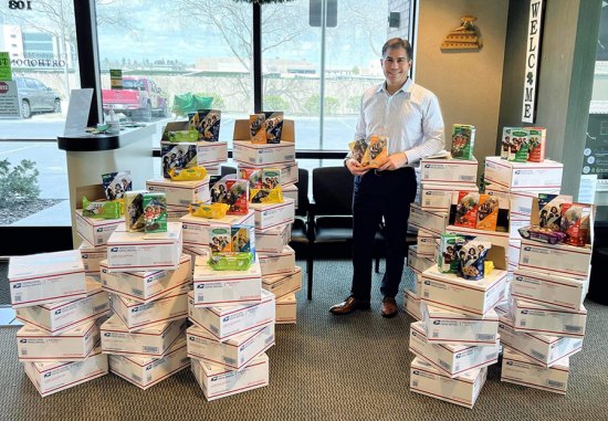 Lemoore native and Hanford orthodontist, Dr. Chris Rose, and staff, send Girl Scout cookies to sailors at sea Local orthodontist, Dr. Chris Rose, poses with Girl Scout cookies bound for sailors on deployment.